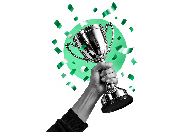 A raised trophy amid confetti